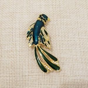 Blue-green bird brooch